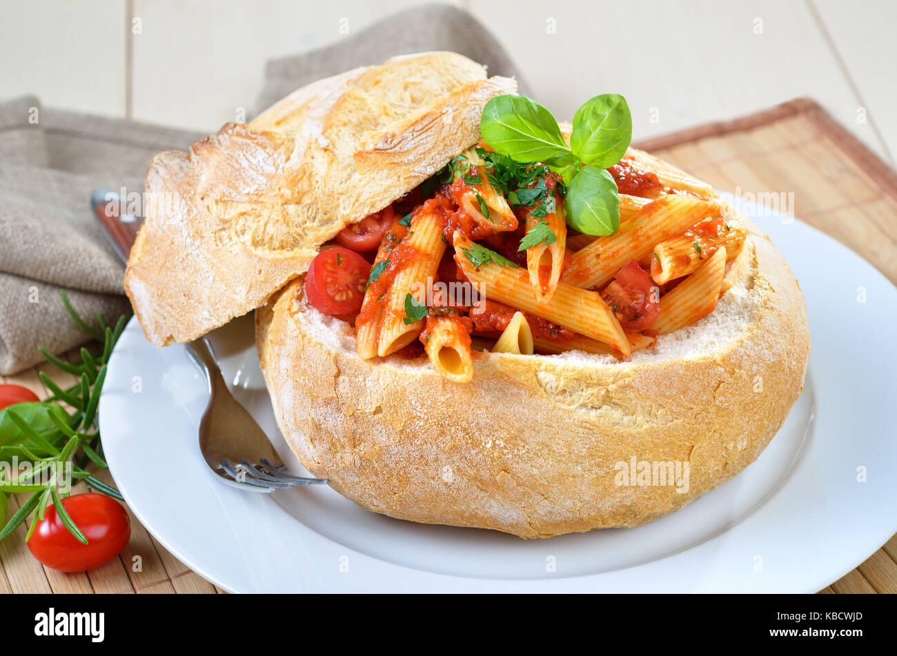 Pasta with tomato sauce filled in Italian ciabatta bread Stock Photo