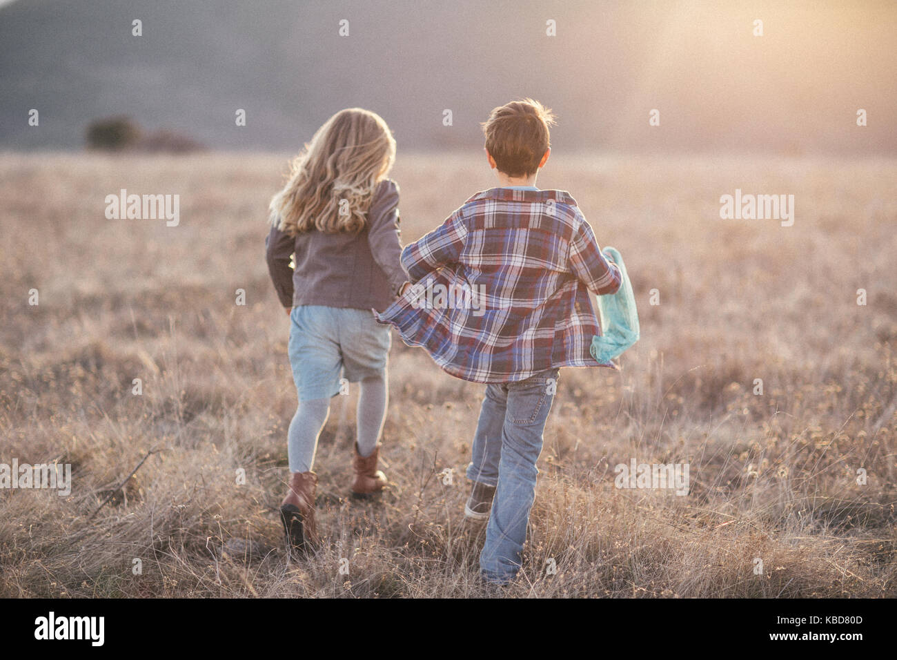 Boy And Girl Running Into The Sunset And Holding Hands High Resolution Stock Photography And Images Alamy Boy And Girl Running Into The Sunset And Holding Hands High Resolution Stock Photography And Images Alamy
