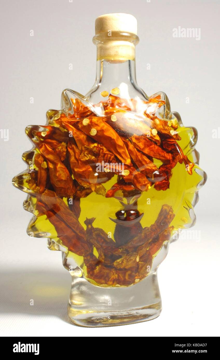 Olive oil with chili peppers Stock Photo Alamy