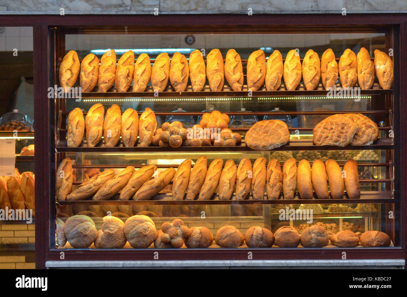 Baked bread on the bakery display window Stock Photo - Alamy