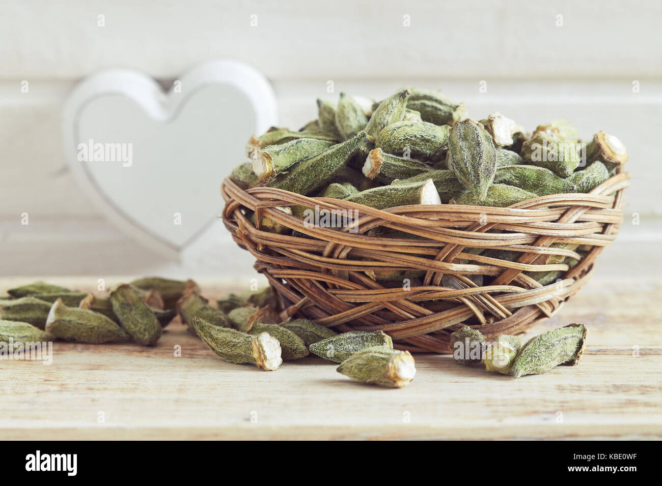 Dried okra (ladies' fingers, ochro) in woven basket Stock Photo