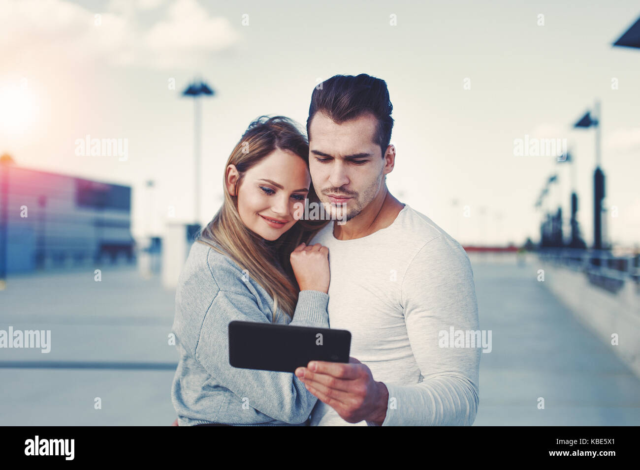 Young smart businesswoman holding tablet and eyeglasses cinematic style Stock Photo