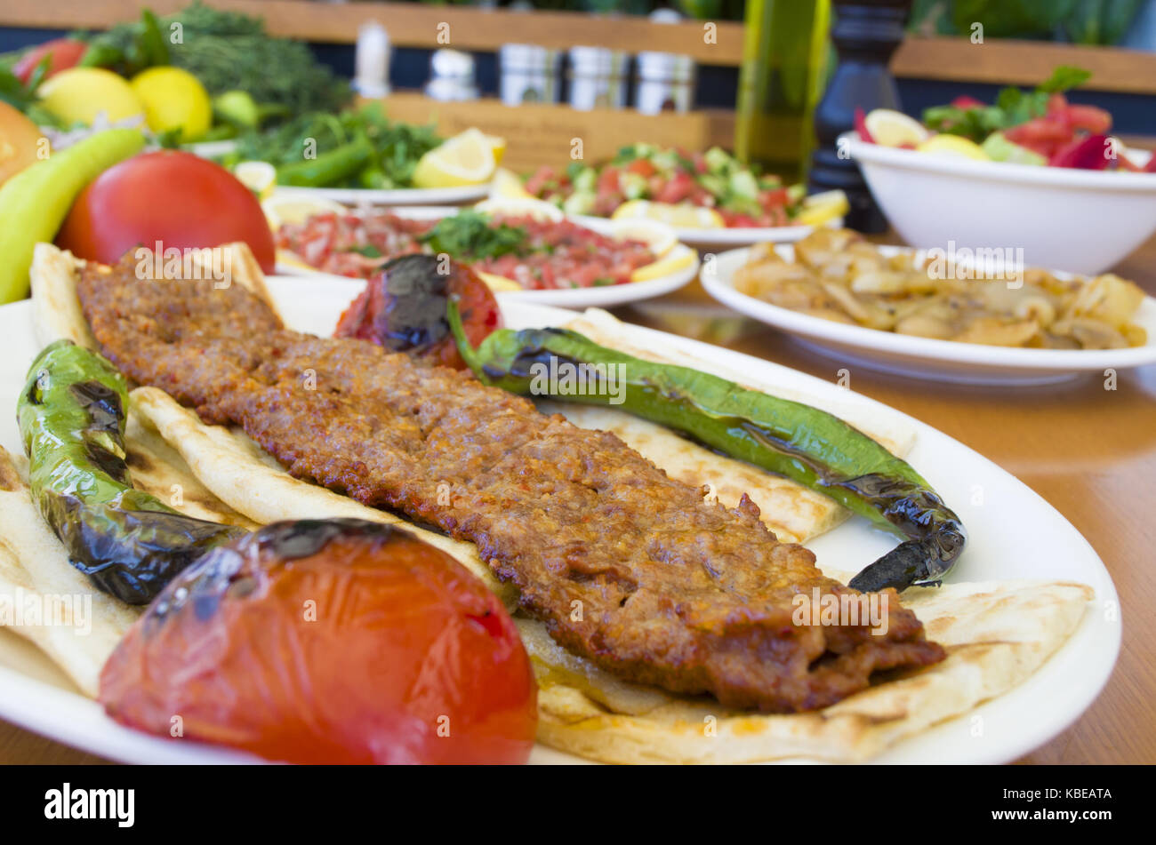 Turkish adana kebab and salads menu Stock Photo Alamy