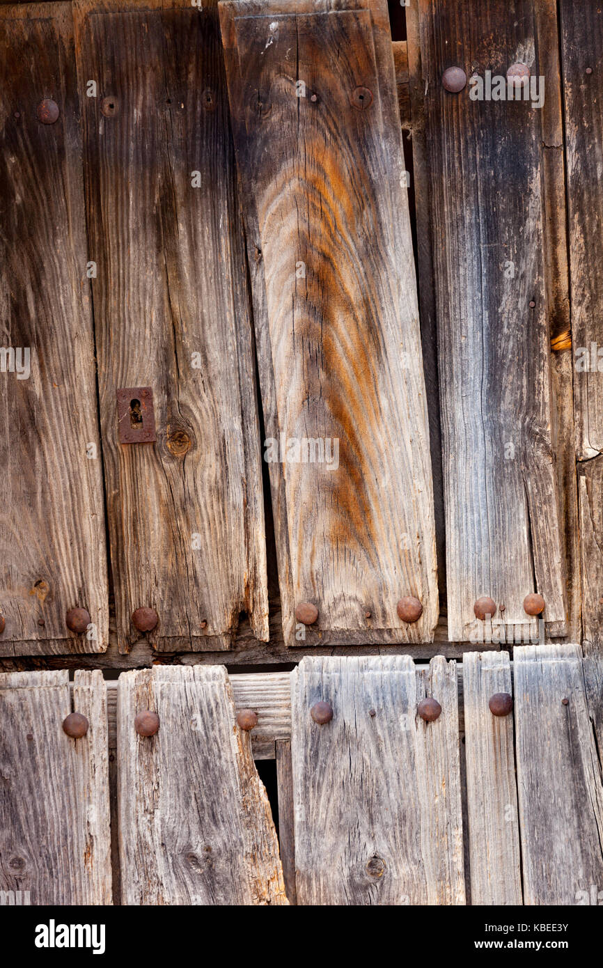 Old wooden door a with rusty lock Stock Photo - Alamy