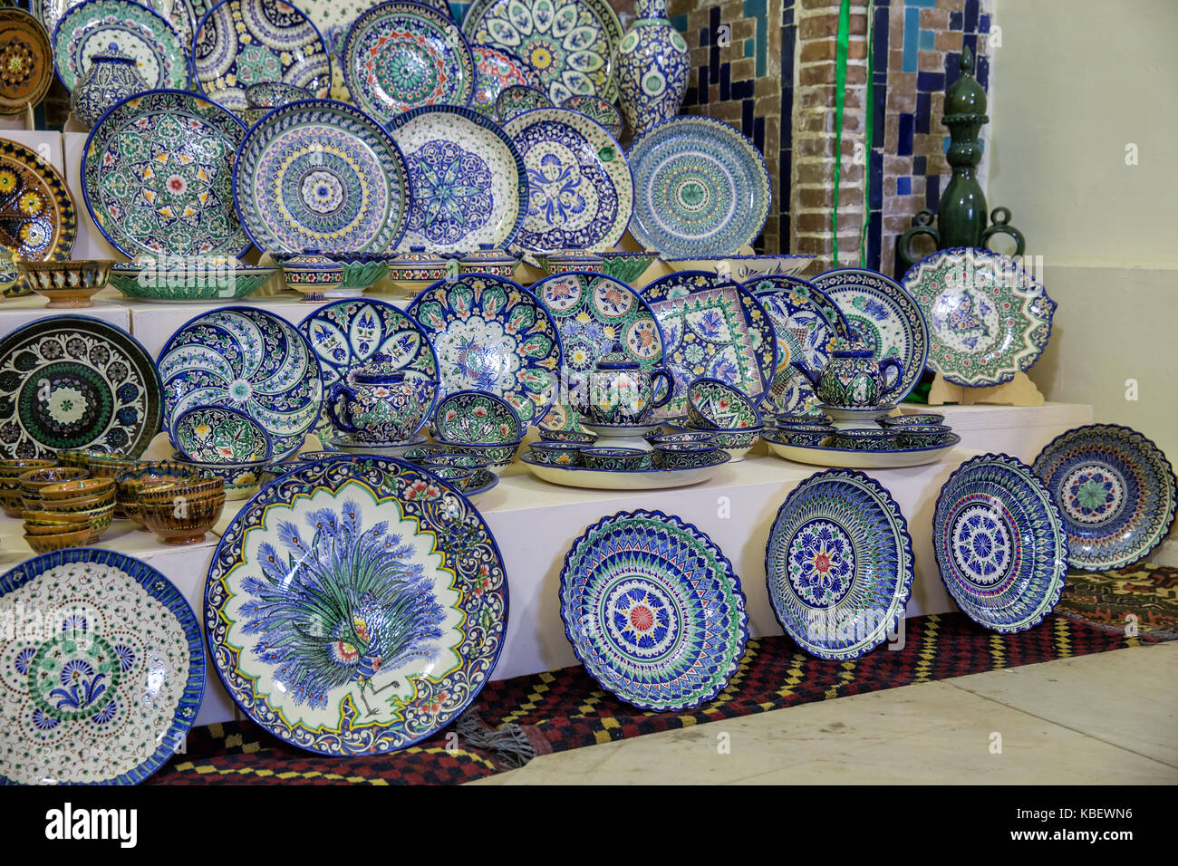Sale of traditional Uzbek dishes in a souvenir shop at the Samarkand market Stock Photo