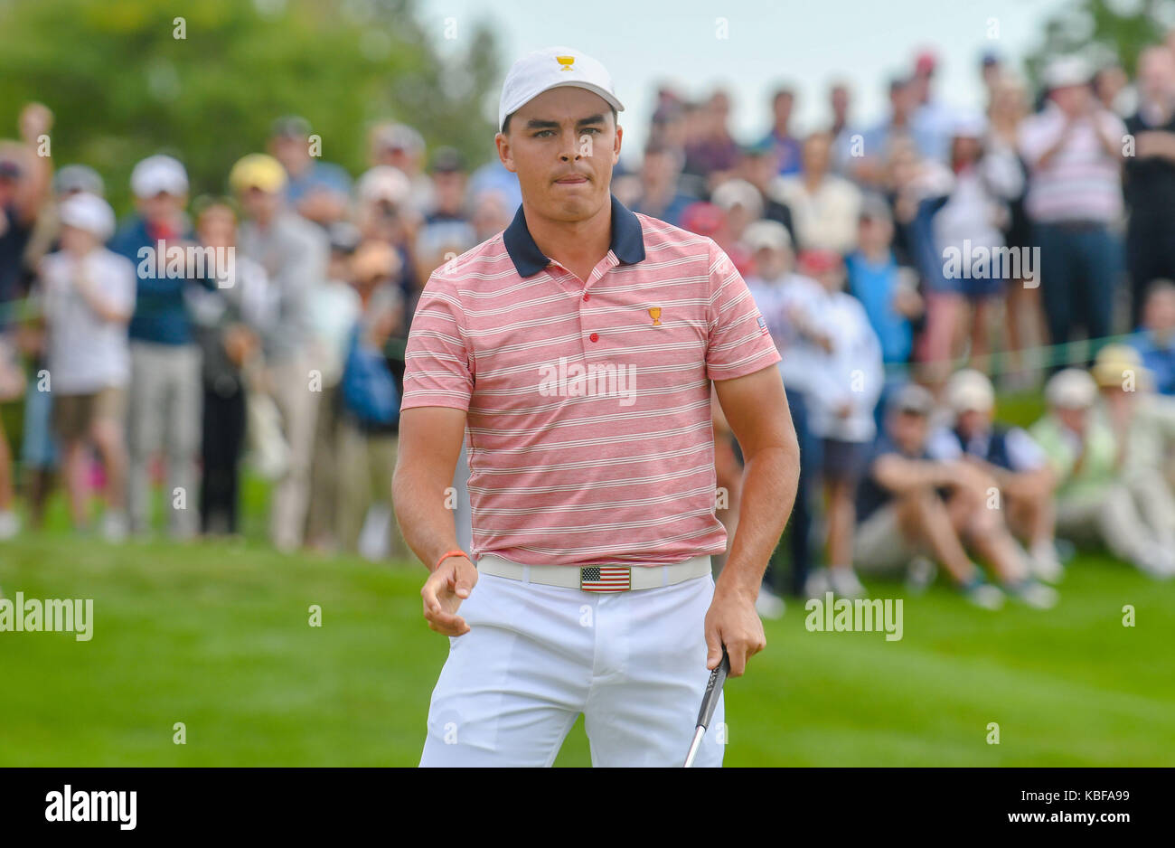 Jersey City, USA. 29th Sep, 2017. Rickie Fowler of the United States reacts after sinking a putt on the 3rd hole during the second round of the Presidents Cup at Liberty National Golf Course in Jersey City, New Jersey. Credit: Cal Sport Media/Alamy Live News Stock Photo