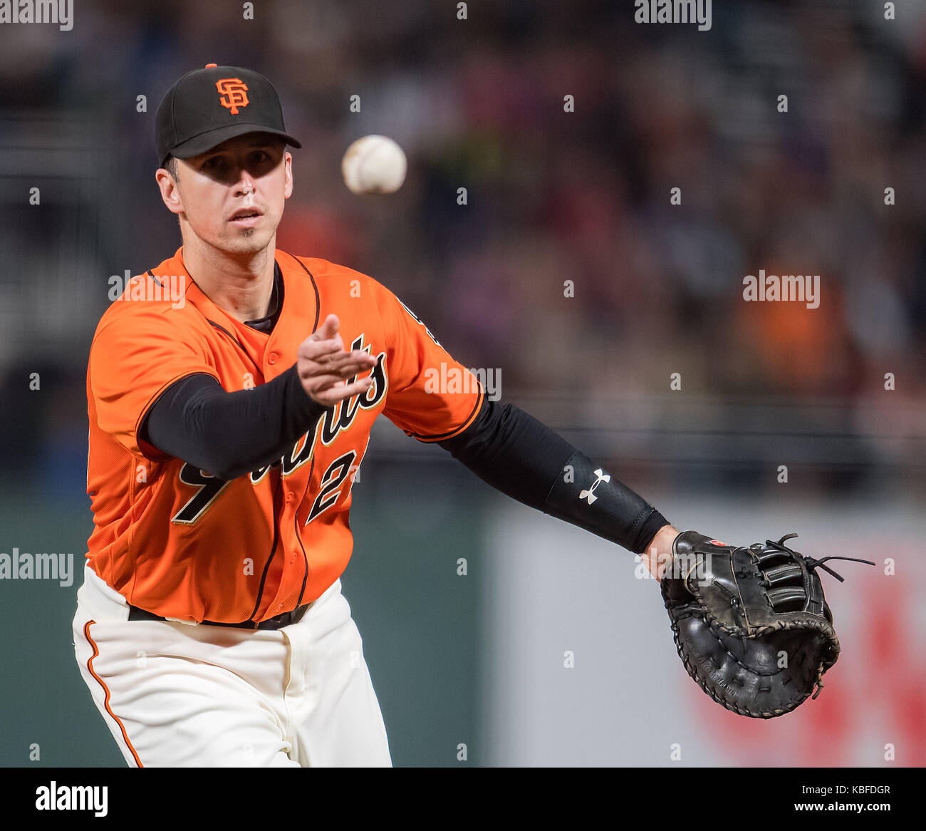 San Francisco, California, USA. 29th Sep, 2017. San Francisco Giants first baseman Buster Posey (28) makes a toss Chris Stratton (not shown) to end the second inning, during a MLB game between the San Diego Padres and the San Francisco Giants at AT&T Park in San Francisco, California. Valerie Shoaps/CSM/Alamy Live News Stock Photo