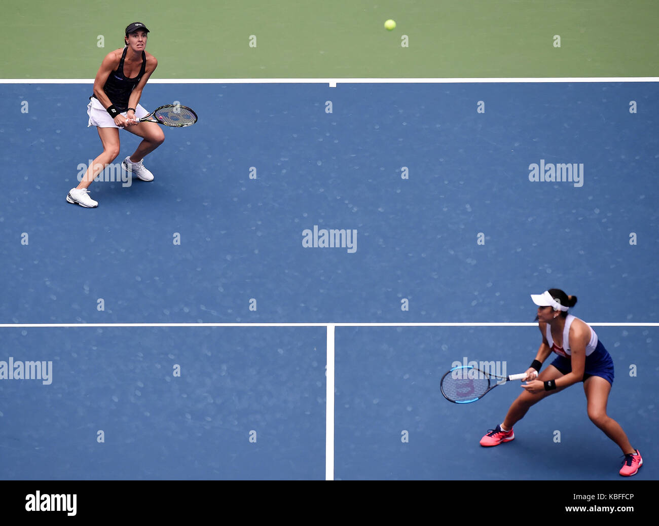 Wuhan, China. 30th September, 2017. Martina Hingis (L) of Switzerland