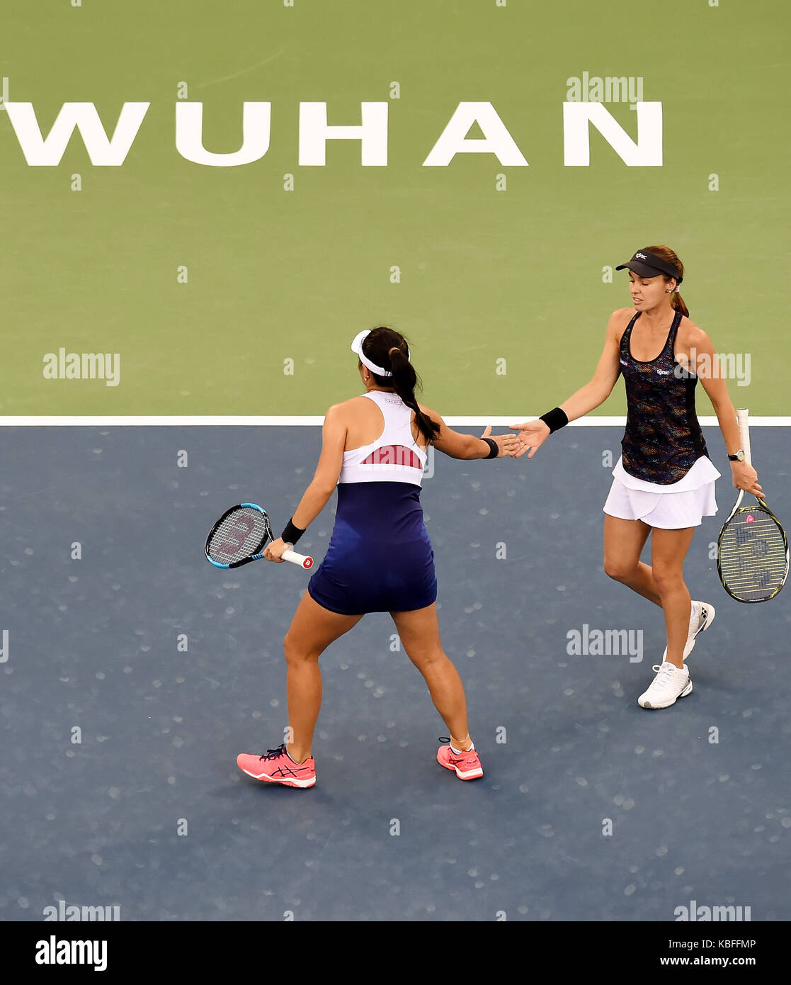 Wuhan, China. 30th September, 2017. Martina Hingis (R) of Switzerland