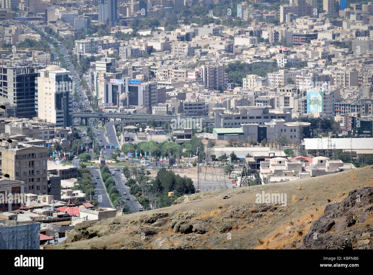 Iran city skyline from the mountains - Urban growth and development in Karaj near Tehran Stock Photo