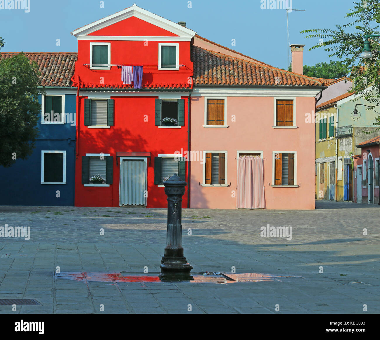 colored house in BURANO and a fountain near Venice in Northen Italy Stock Photo