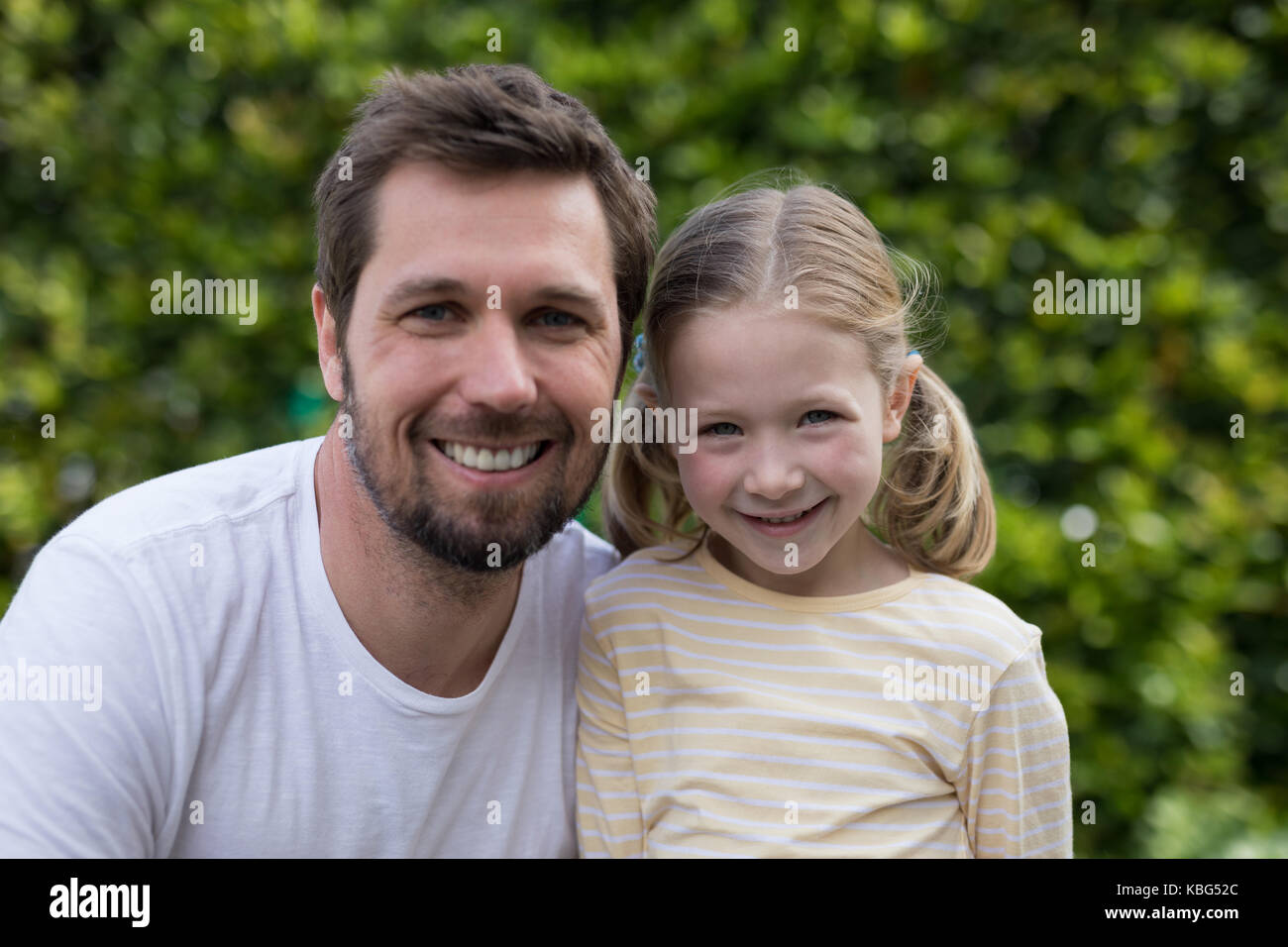 Portrait of father and daughter in the park Stock Photo - Alamy