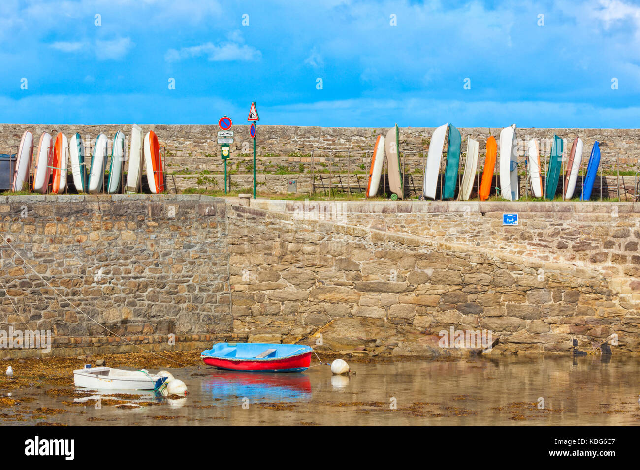 Stored boats in a row on the pier of Roscoff harbor Stock Photo