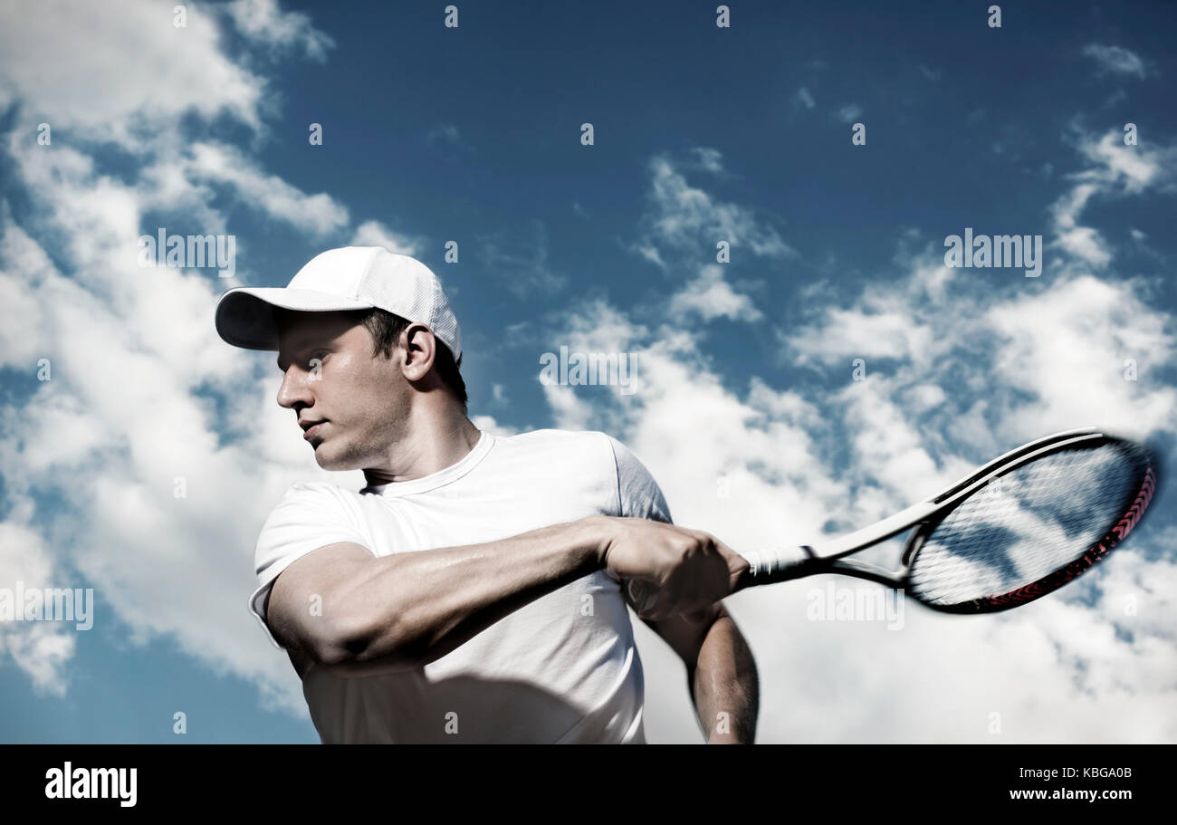 male tennis player in action, motion blurs Stock Photo