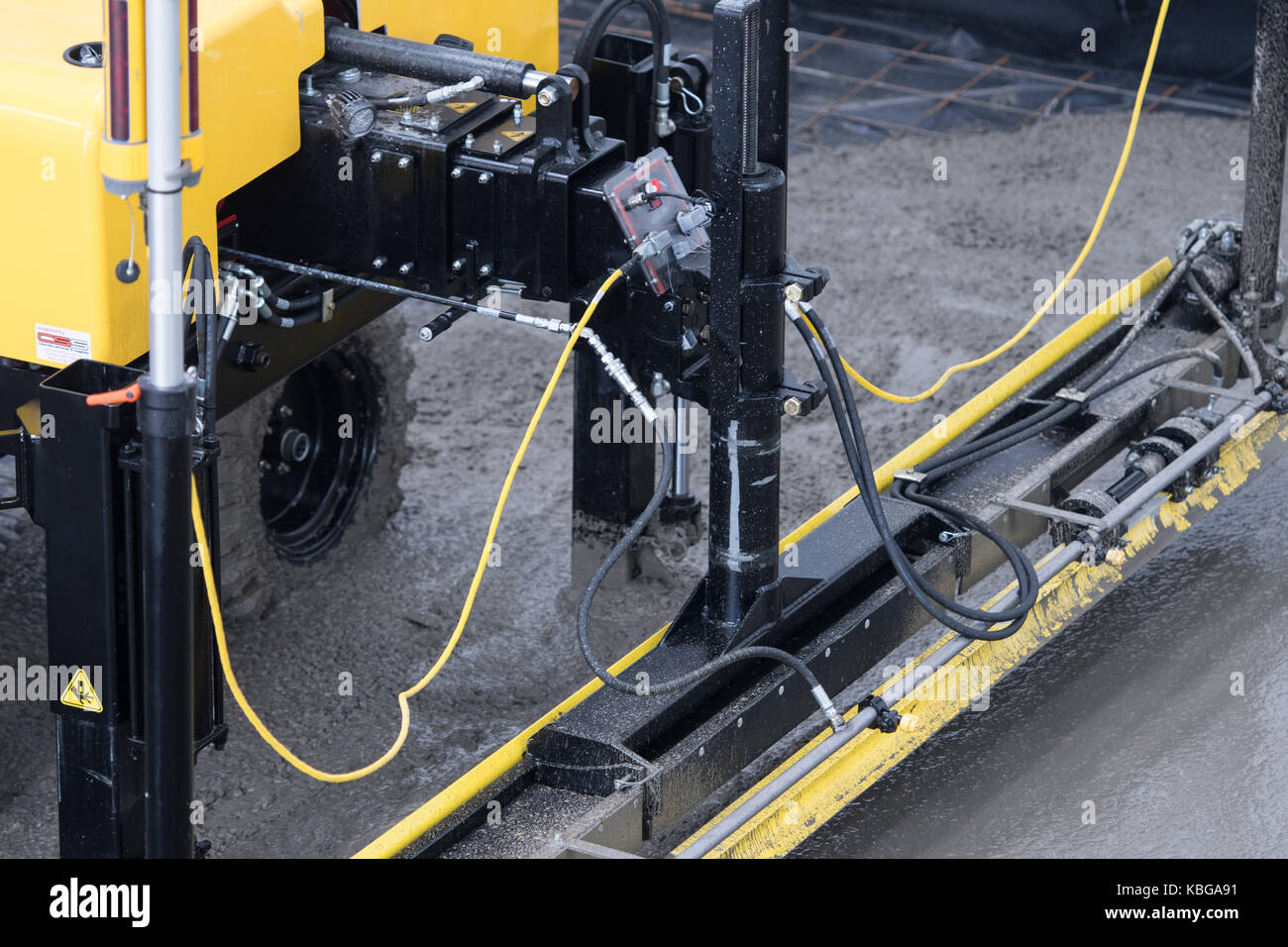 Screed machine used to lay laser level smooth concrete floor Stock