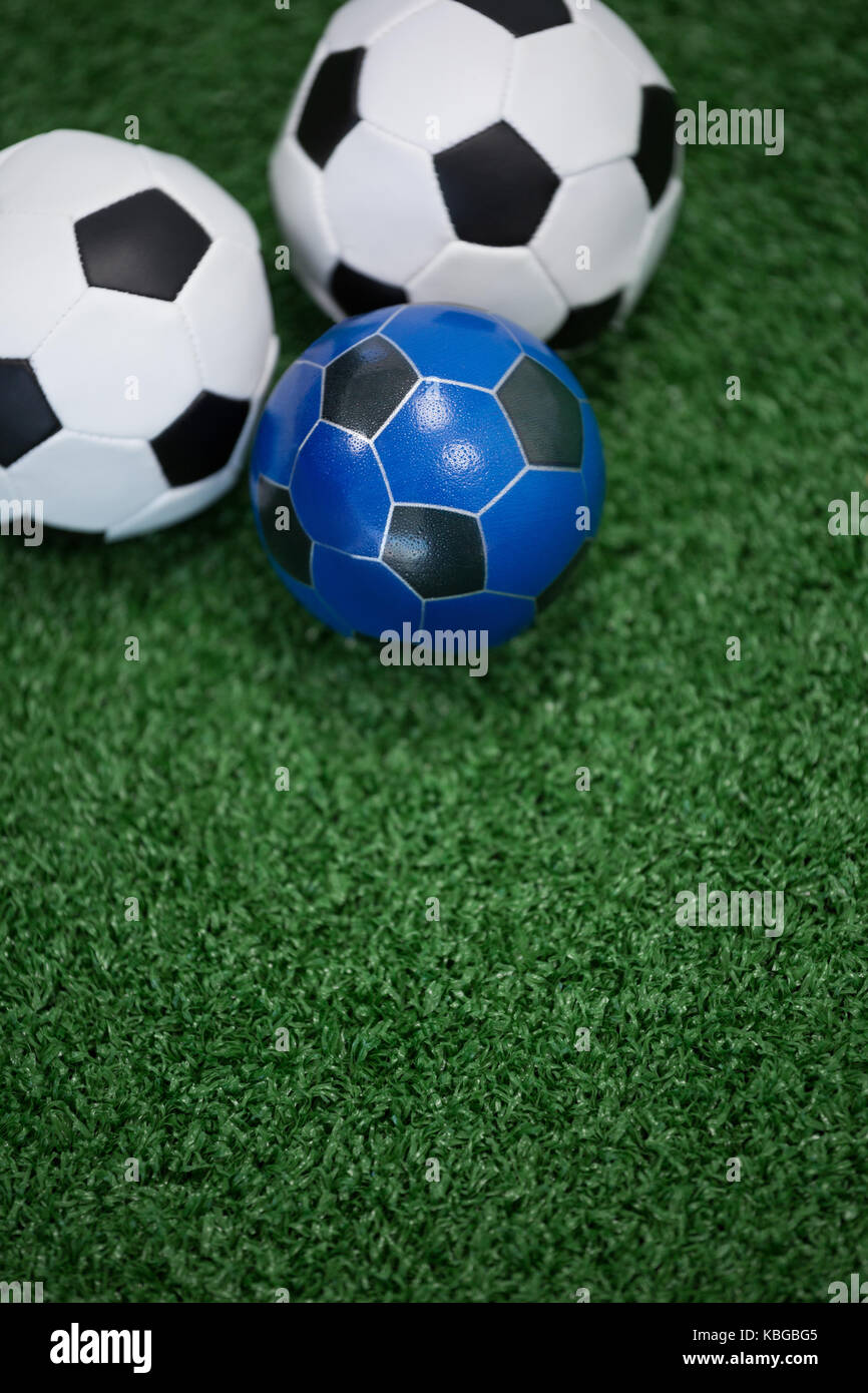 Closeup of footballs on artificial grass Stock Photo Alamy