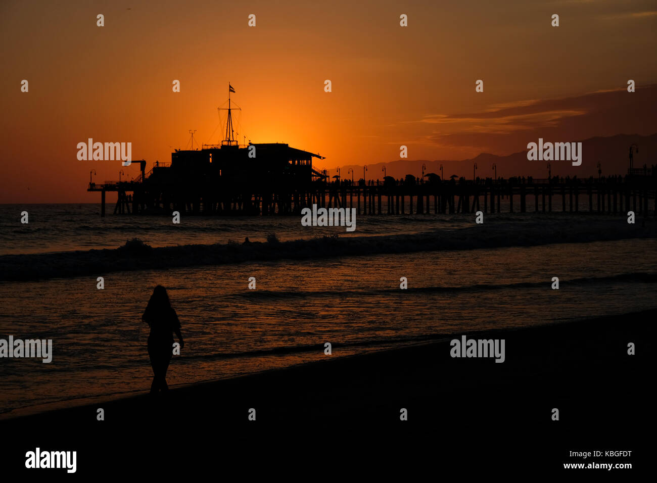 The famous Santa Monica pier and Pacific Park during a summer sunset in Los Angeles, California, USA. Stock Photo
