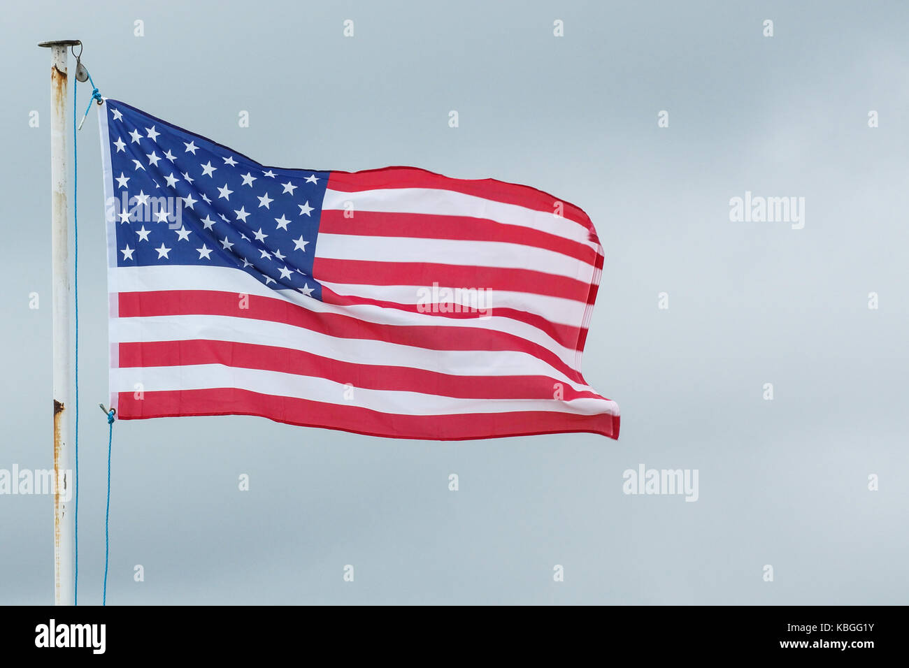 The flag of the United States Of America blows in the wind Stock Photo