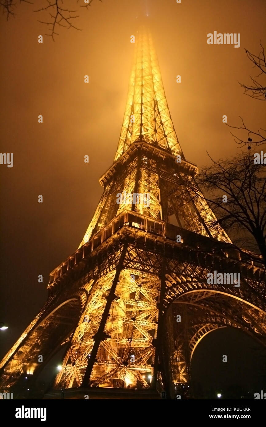 Eiffel Tower in Paris foggy night Stock Photo