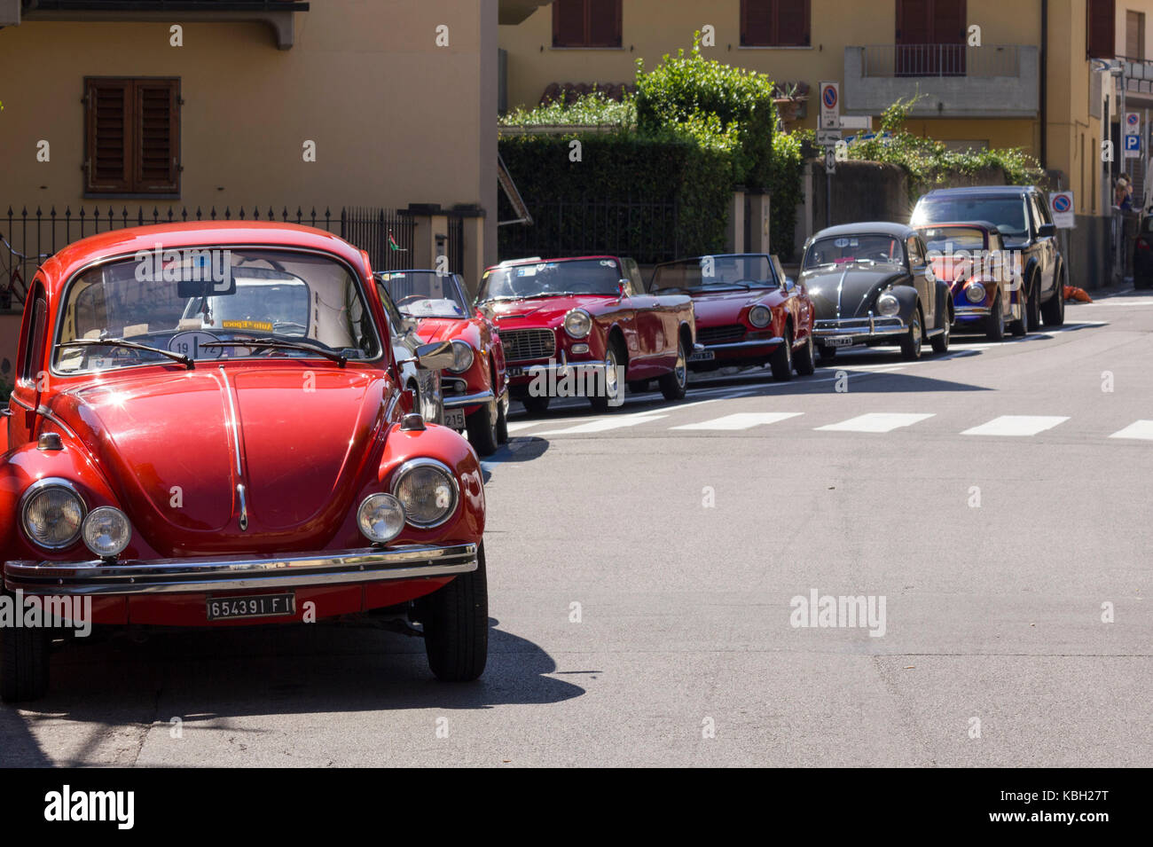LASTRA A SIGNA, ITALY - AUGUST 30 2015: Row of vintage cars parked on the street in Lastra a Signa during an historic cars exhibition Stock Photo
