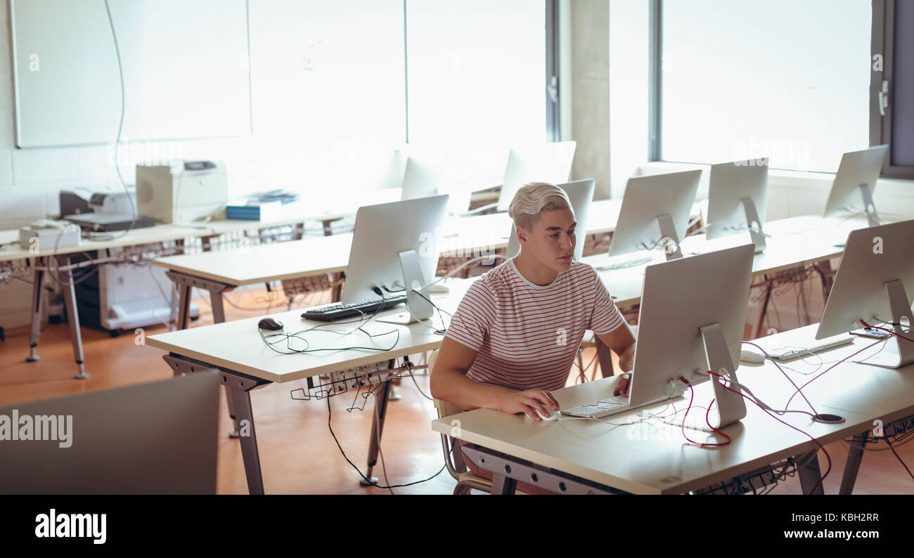 Man working on personal computer in office Stock Photo - Alamy