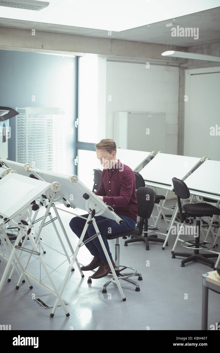 Architect working at drafting table in studio Stock Photo Alamy
