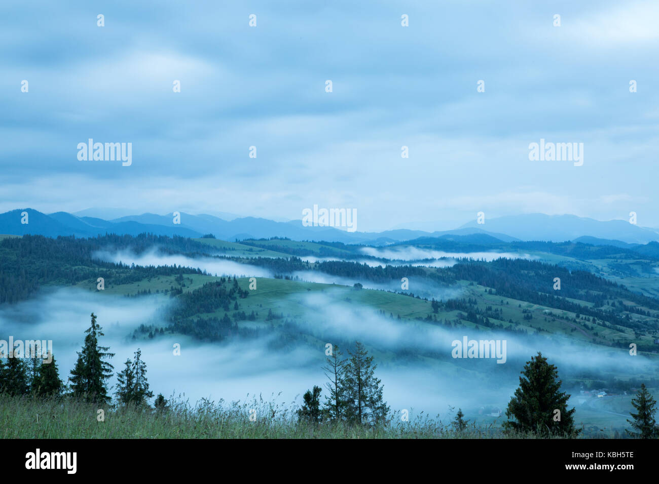 Beautiful landscape on mountain with clouds in the sky Stock Photo - Alamy