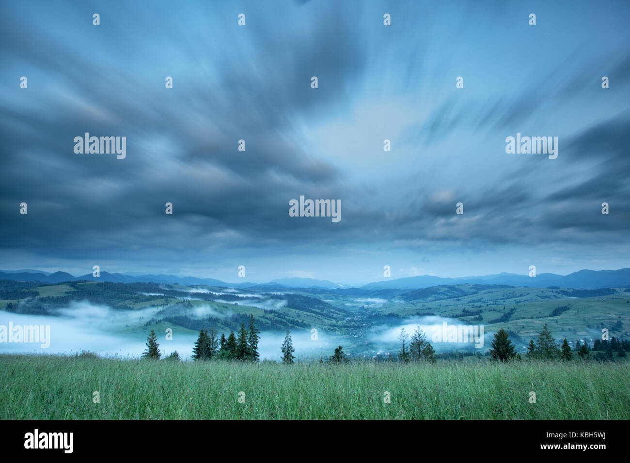Beautiful landscape on mountain with clouds in the sky Stock Photo - Alamy