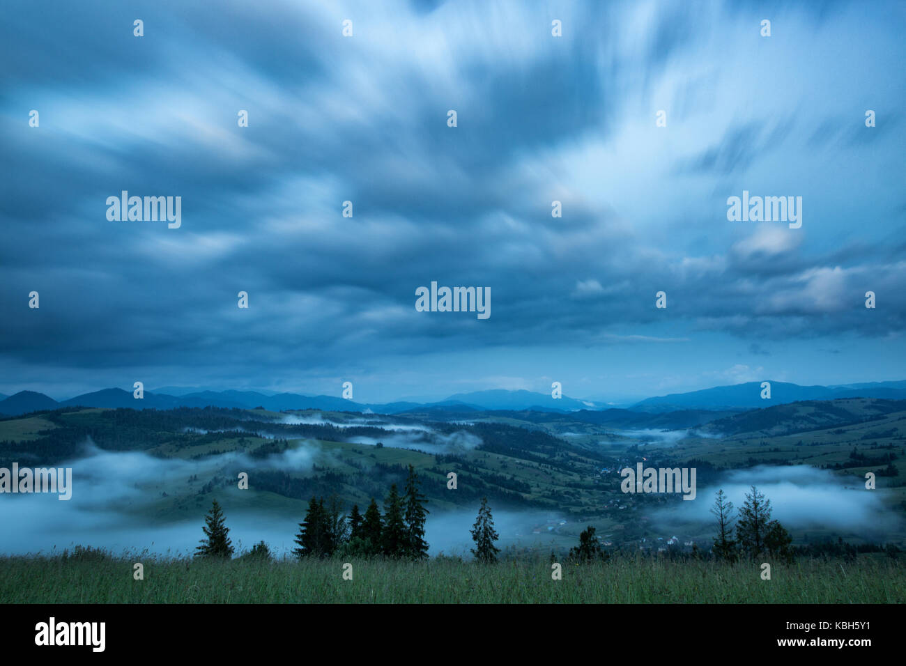 Beautiful landscape on mountain with clouds in the sky Stock Photo - Alamy