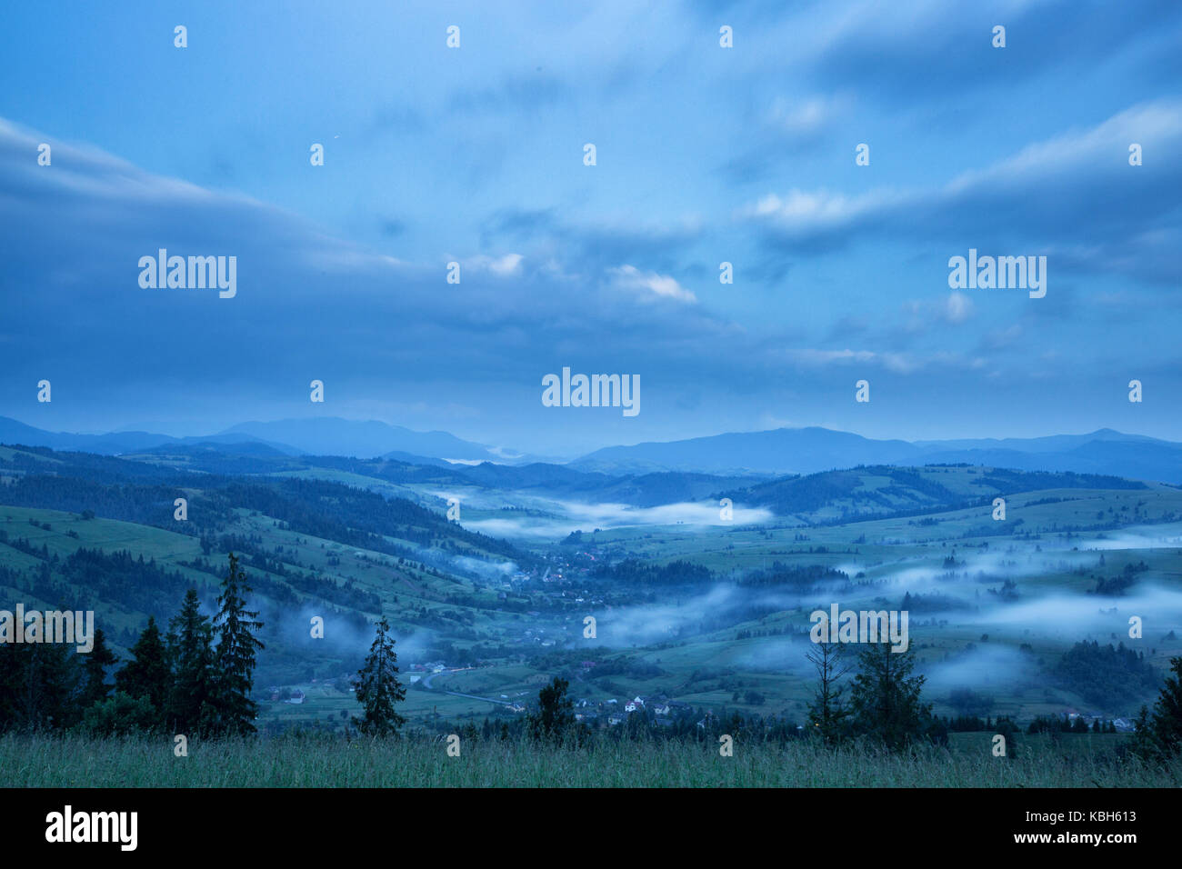 Beautiful landscape on mountain with clouds in the sky Stock Photo - Alamy