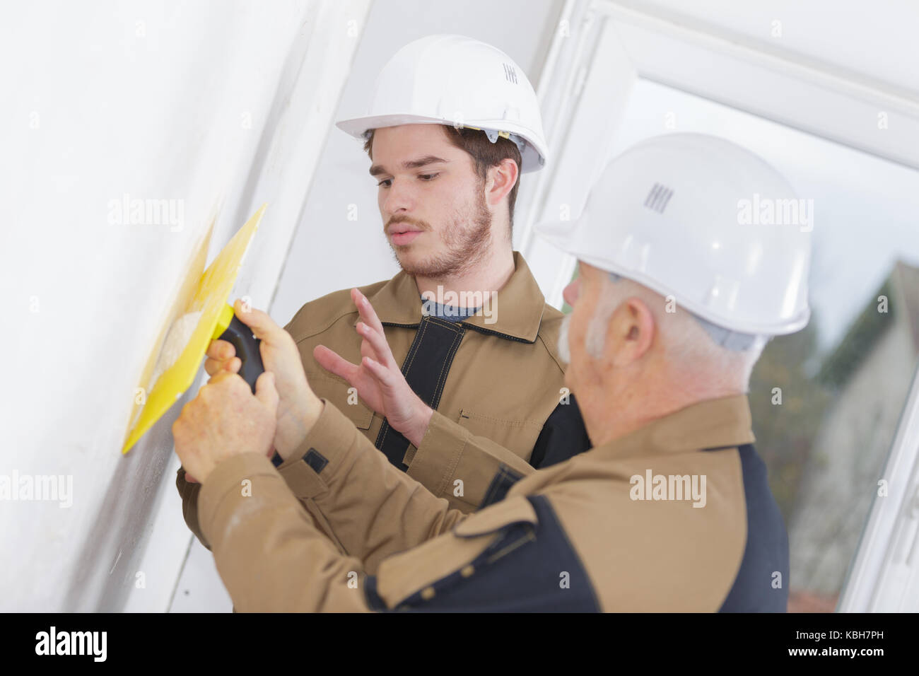 filling the holes on the wall Stock Photo Alamy