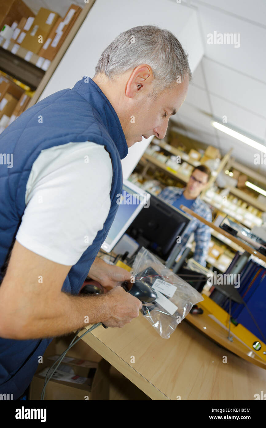 putting an item in the plastic Stock Photo Alamy