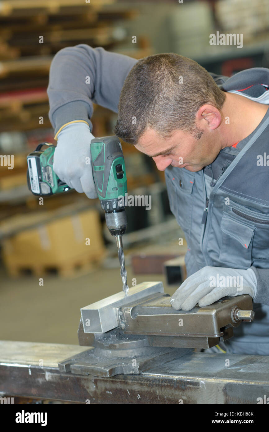 drilling on a steel bar Stock Photo Alamy
