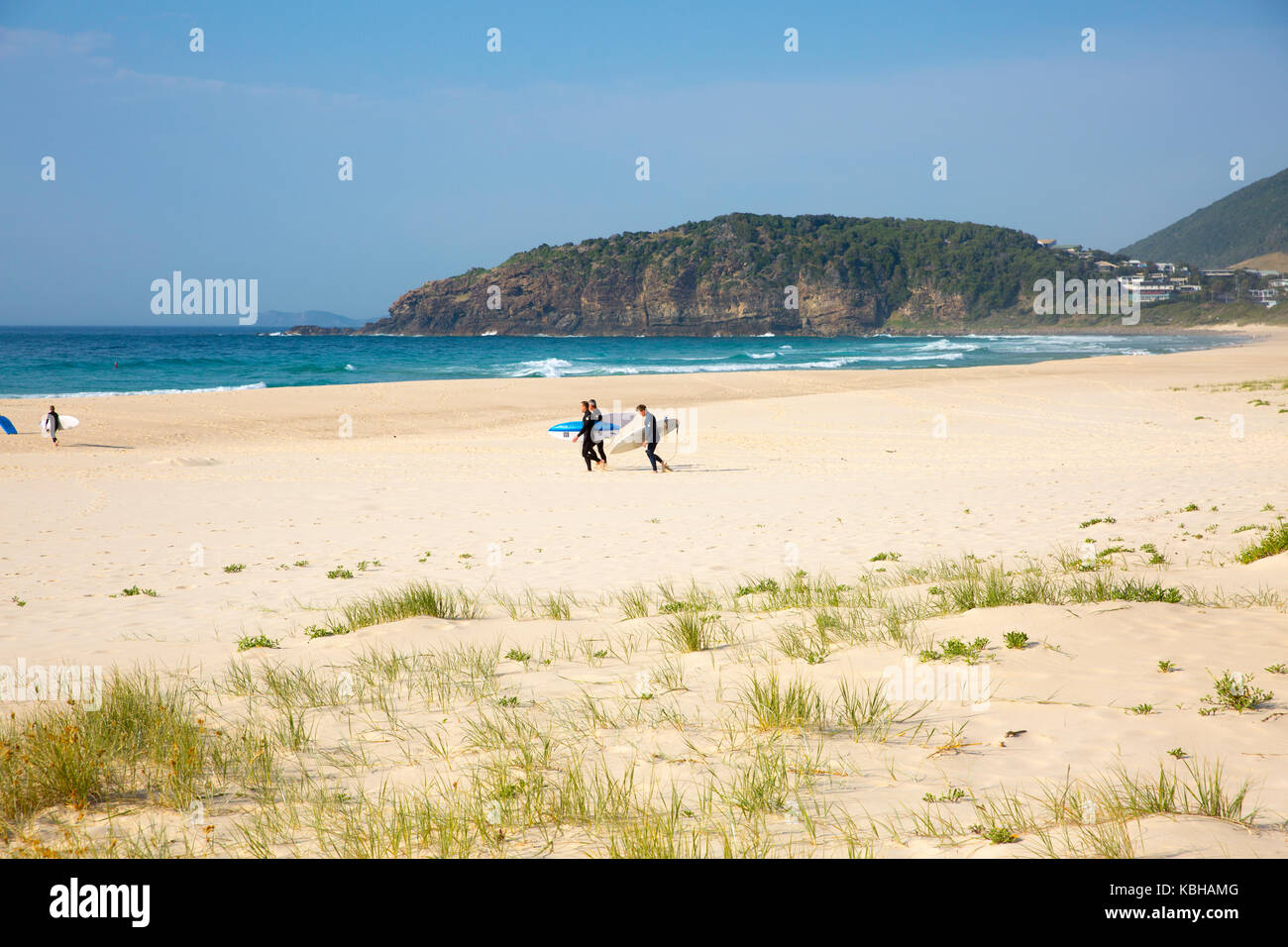 Surfers walking on the sand across Boomerang Beach in Pacific Palms,New