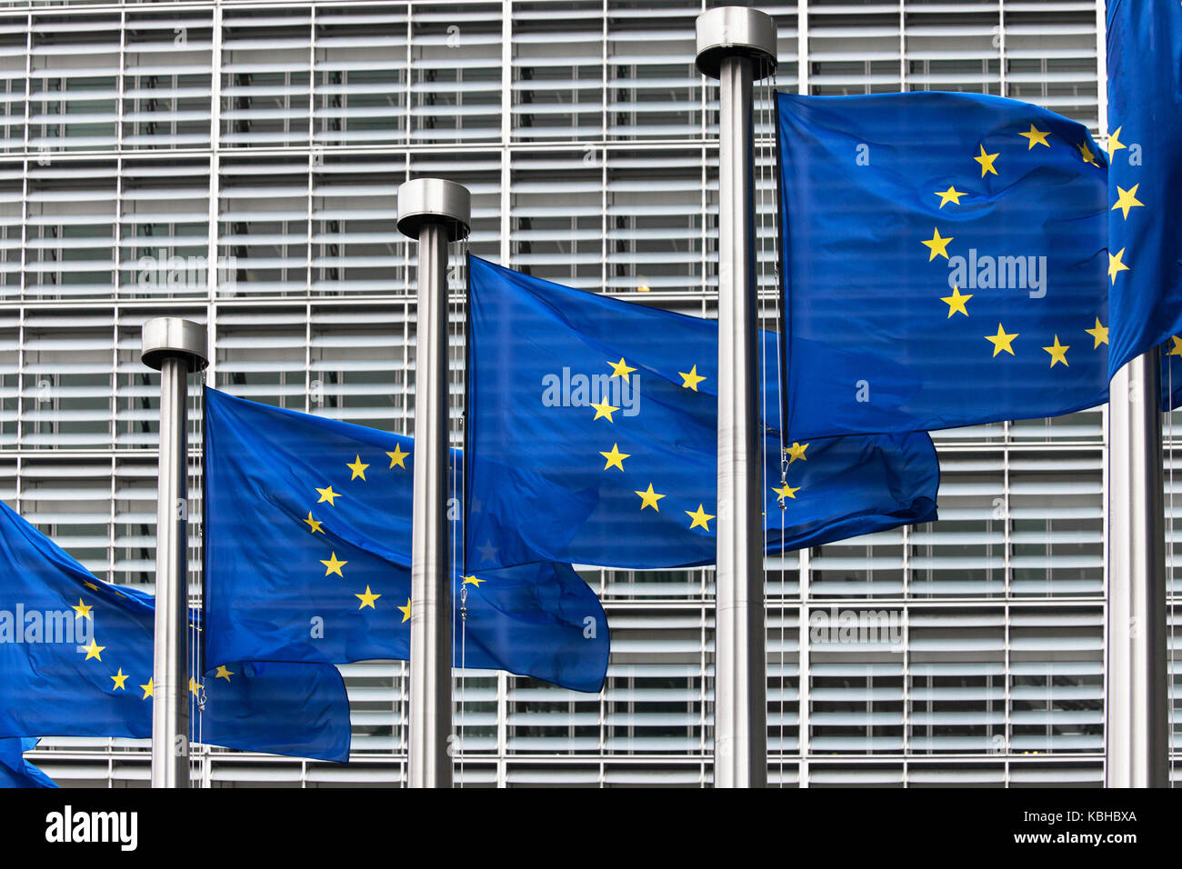 Flags of the European Union in front of the Berlaymont building in Brussels, Belgium. Stock Photo