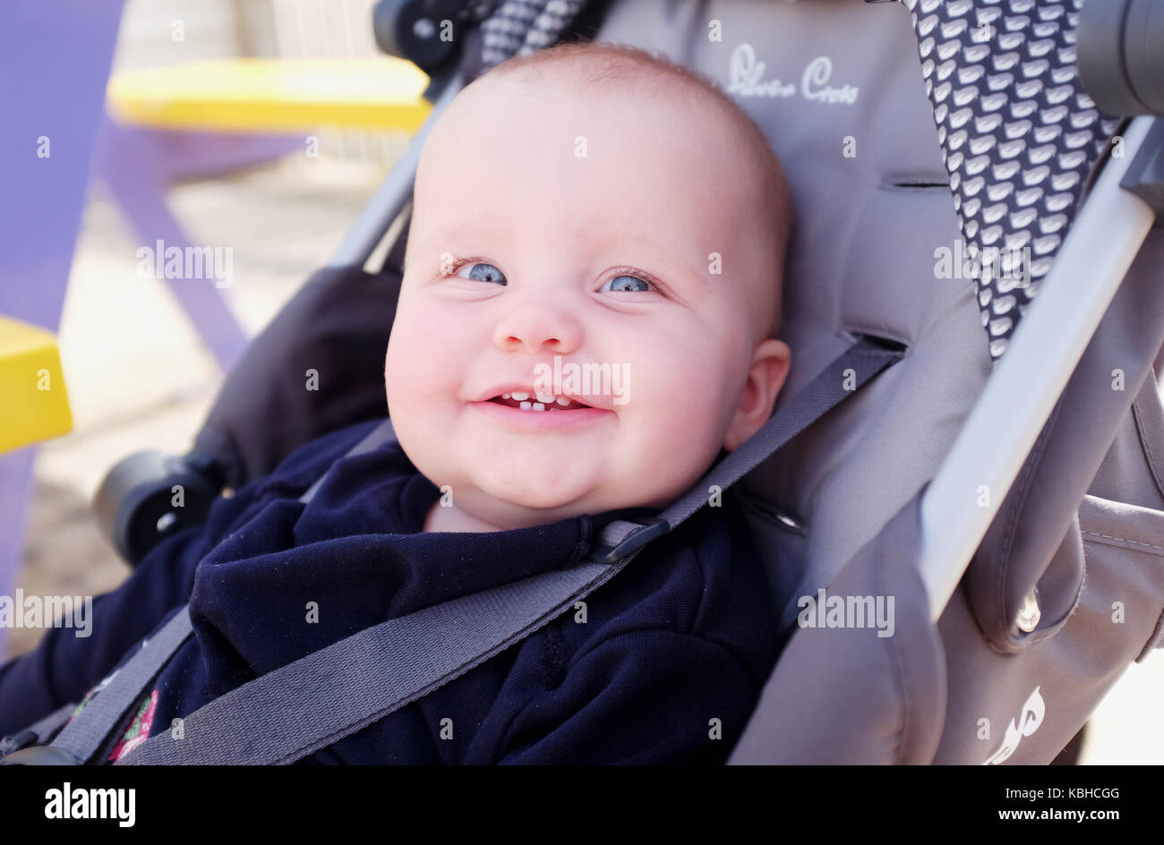 10 month old baby female smiling with new teeth teething UK Stock Photo