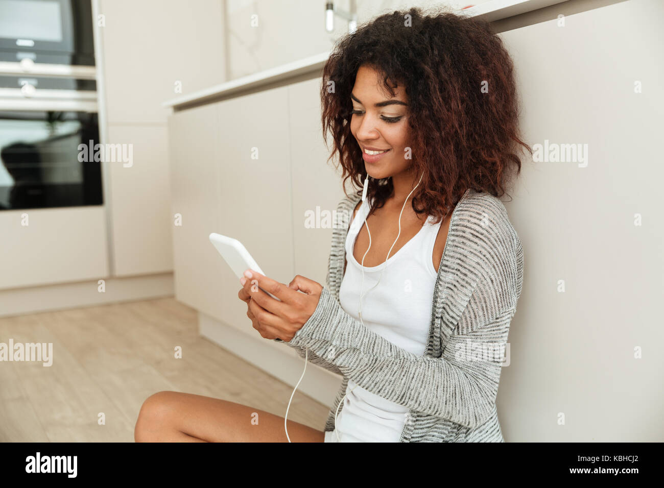 Side view african girl sitting hi-res stock photography and images - Alamy