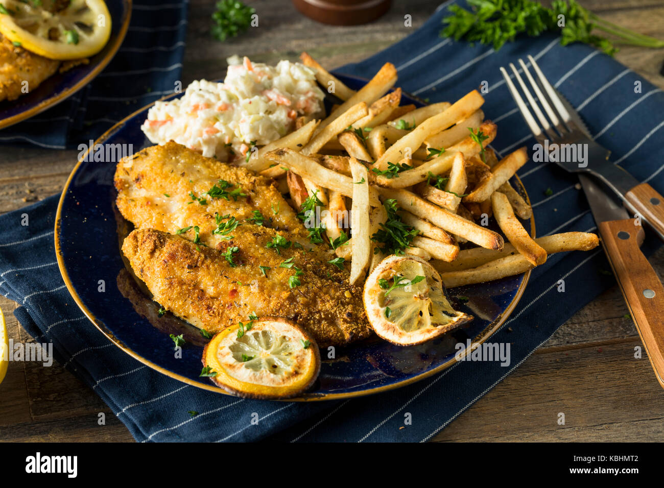 Spicy Homemade BAked Cajun Catfish with French Fries Stock Photo Alamy