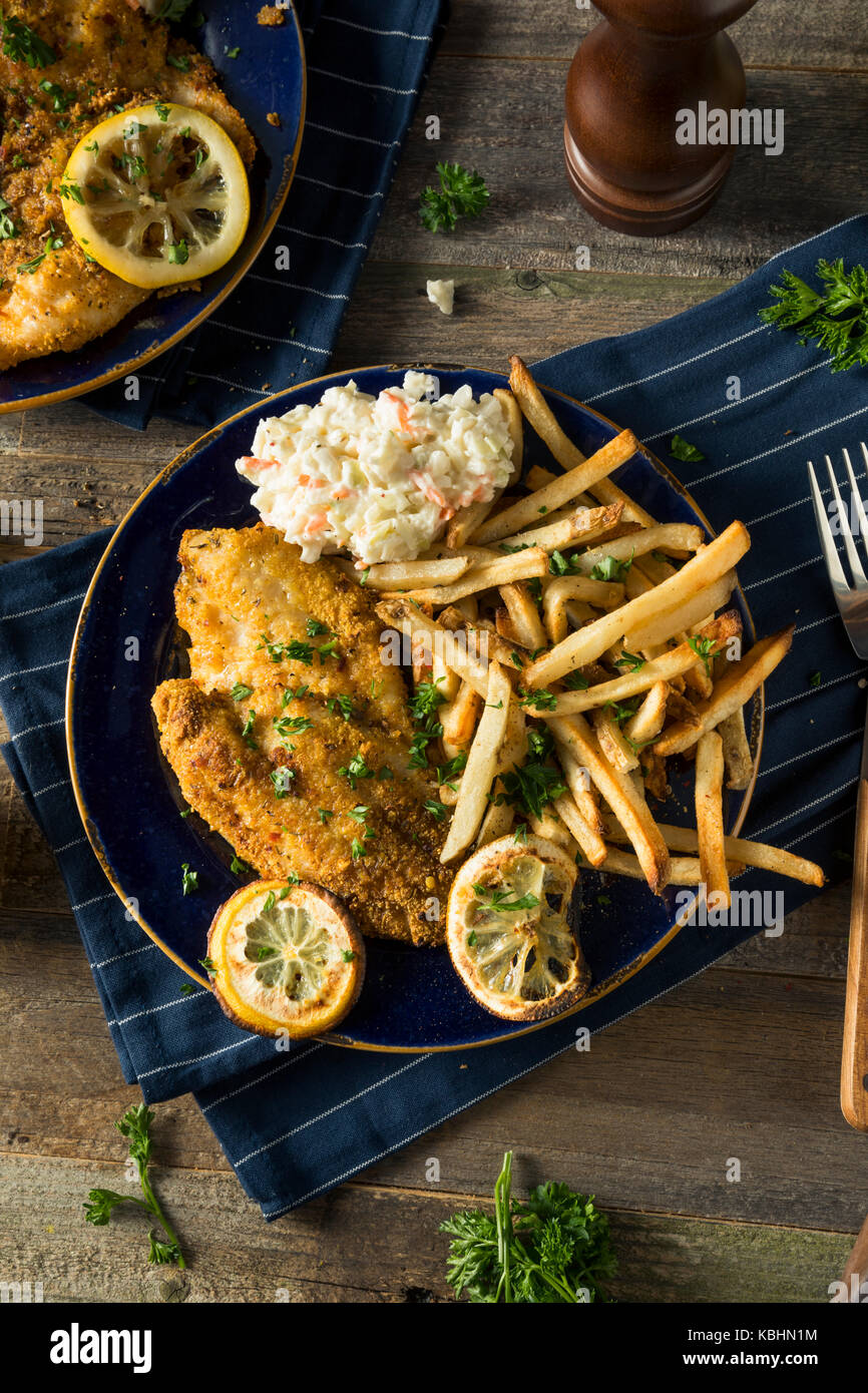 Spicy Homemade BAked Cajun Catfish with French Fries Stock Photo Alamy