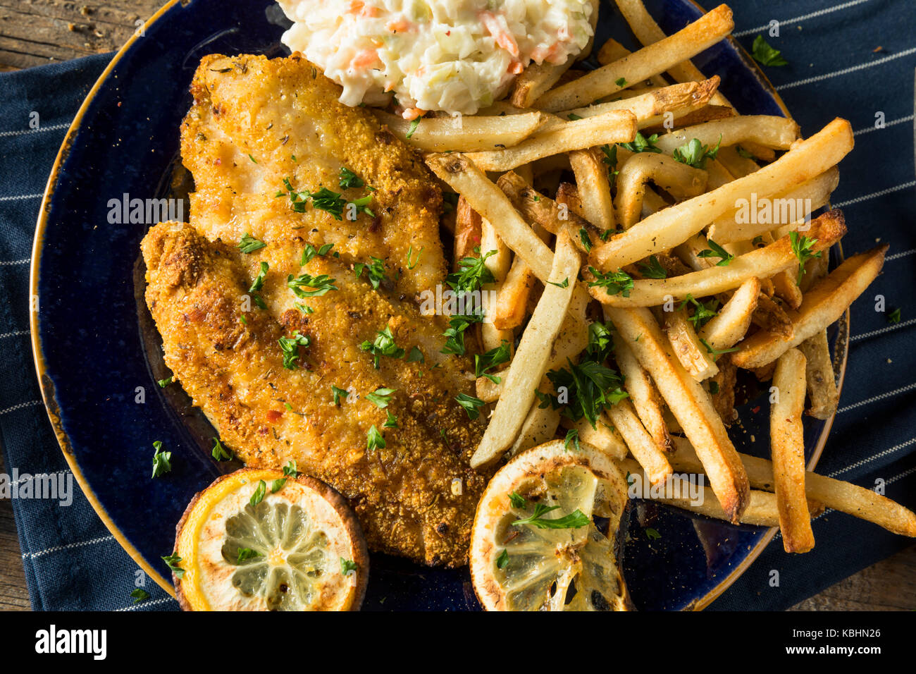 Spicy Homemade BAked  Cajun Catfish with French Fries Stock Photo