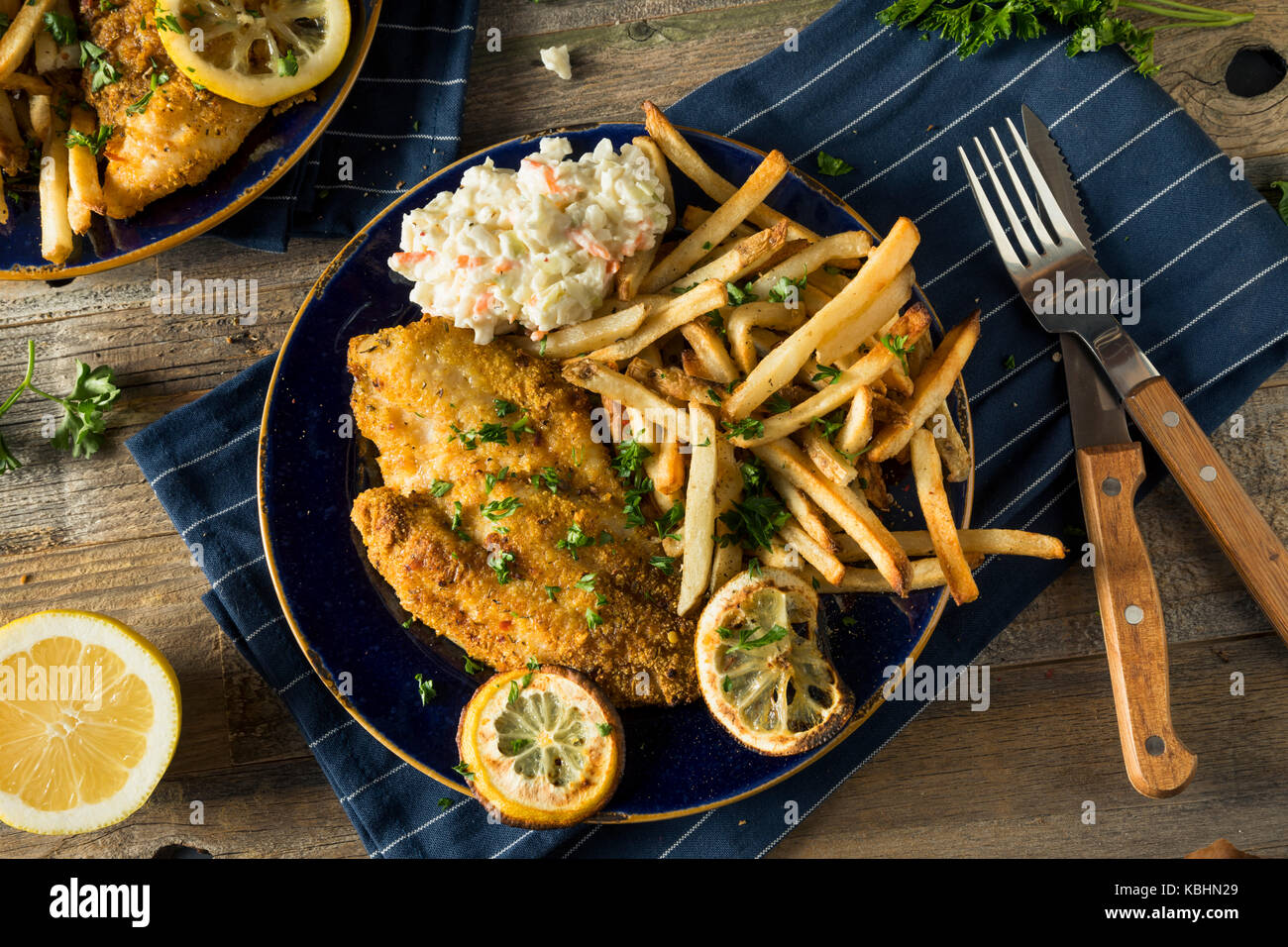 Spicy Homemade BAked Cajun Catfish with French Fries Stock Photo Alamy