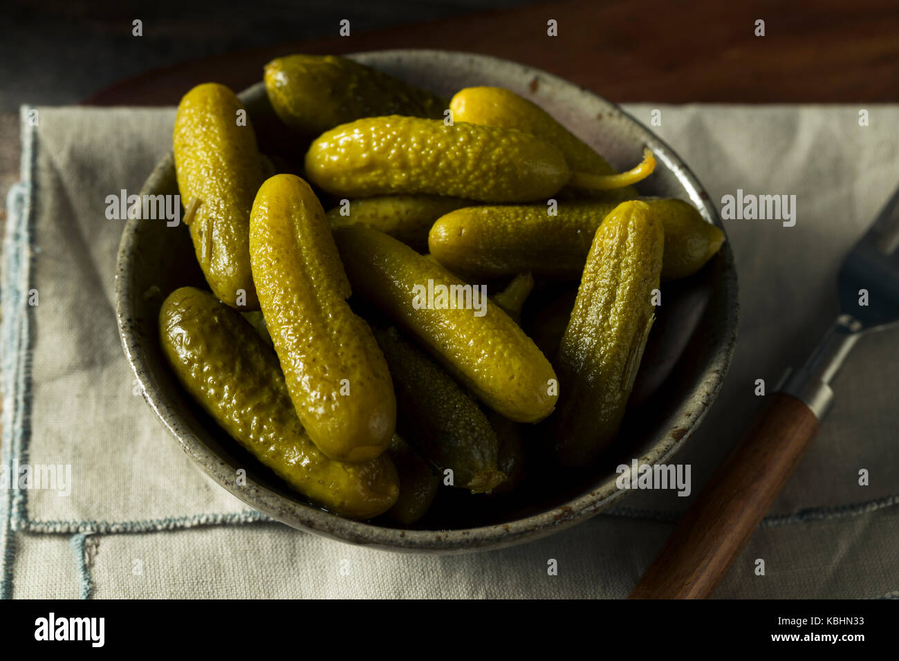 Pickled Organic Cornichon Gherkin Pickles with Dill and Spices Stock Photo