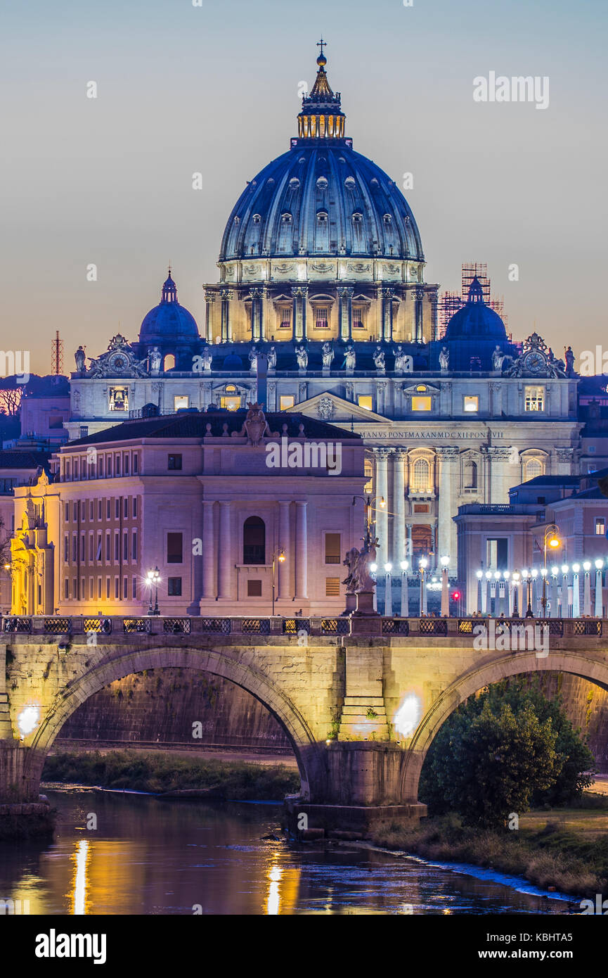 Rome, Italy.Vatican dome of Saint Peter Basilica (San Pietro) and Sant'Angelo Bridge, over Tiber river at dusk. One of the most famous view in the Wor Stock Photo