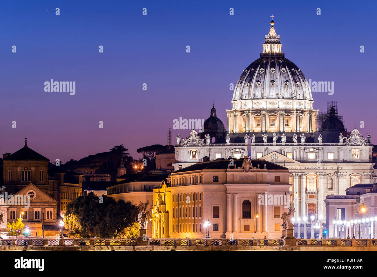 Rome, Italy.Vatican dome of Saint Peter Basilica (San Pietro) and Sant'Angelo Bridge, over Tiber river at dusk. One of the most famous view in the Wor Stock Photo