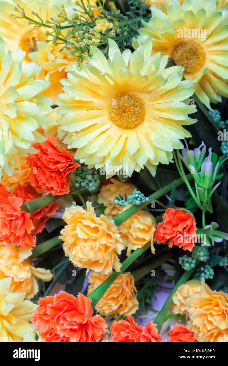 Yellow and orange artificial flowers Stock Photo Alamy