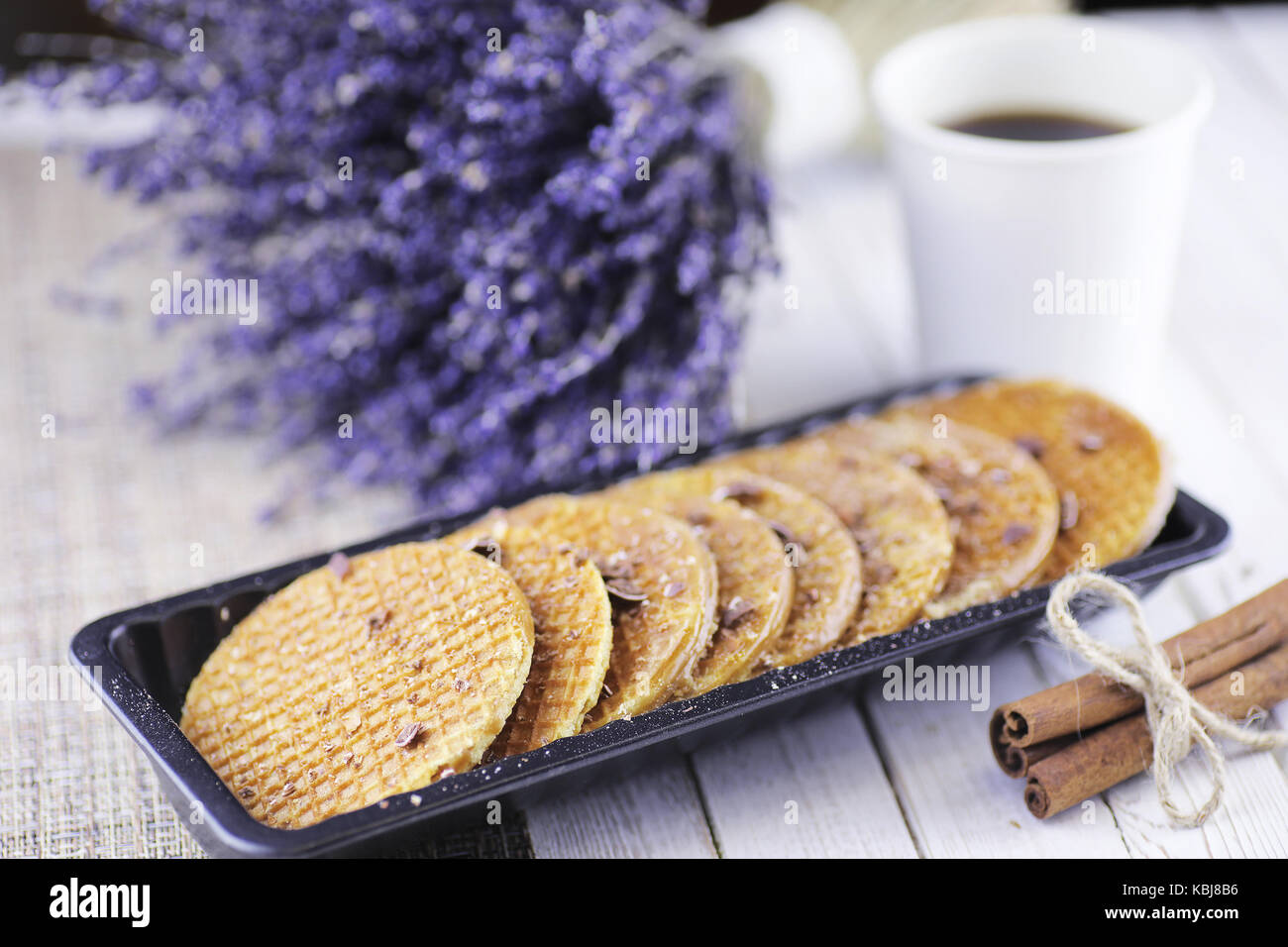 Viennese wafers with caramel on a wooden background Stock Photo - Alamy