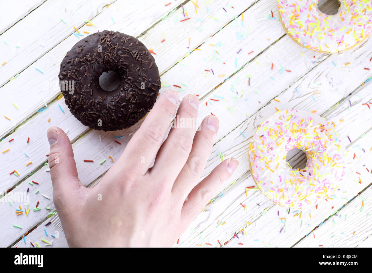 Chocolate Donut on a wooden white background Stock Photo - Alamy