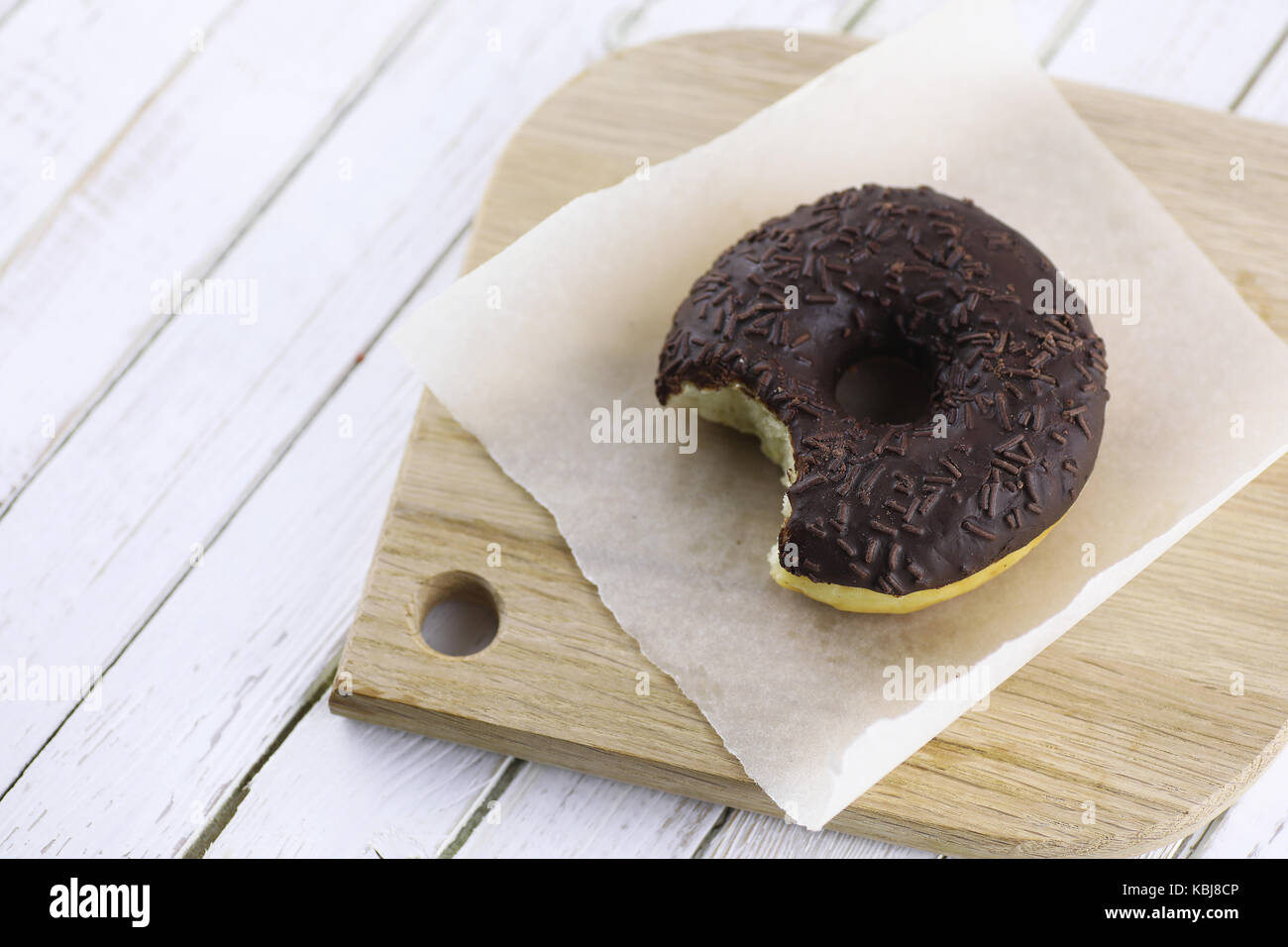 Chocolate Donut on a wooden white background Stock Photo - Alamy
