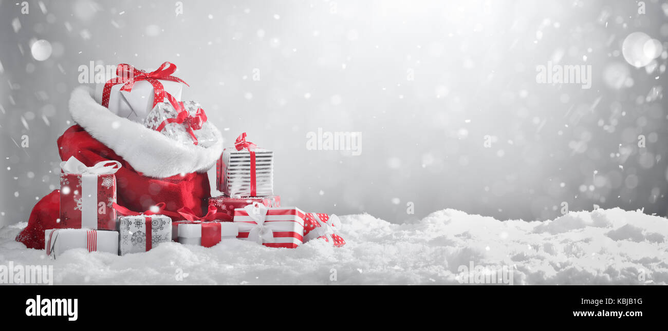 Santa Claus red bag with gift boxes. Stock Photo