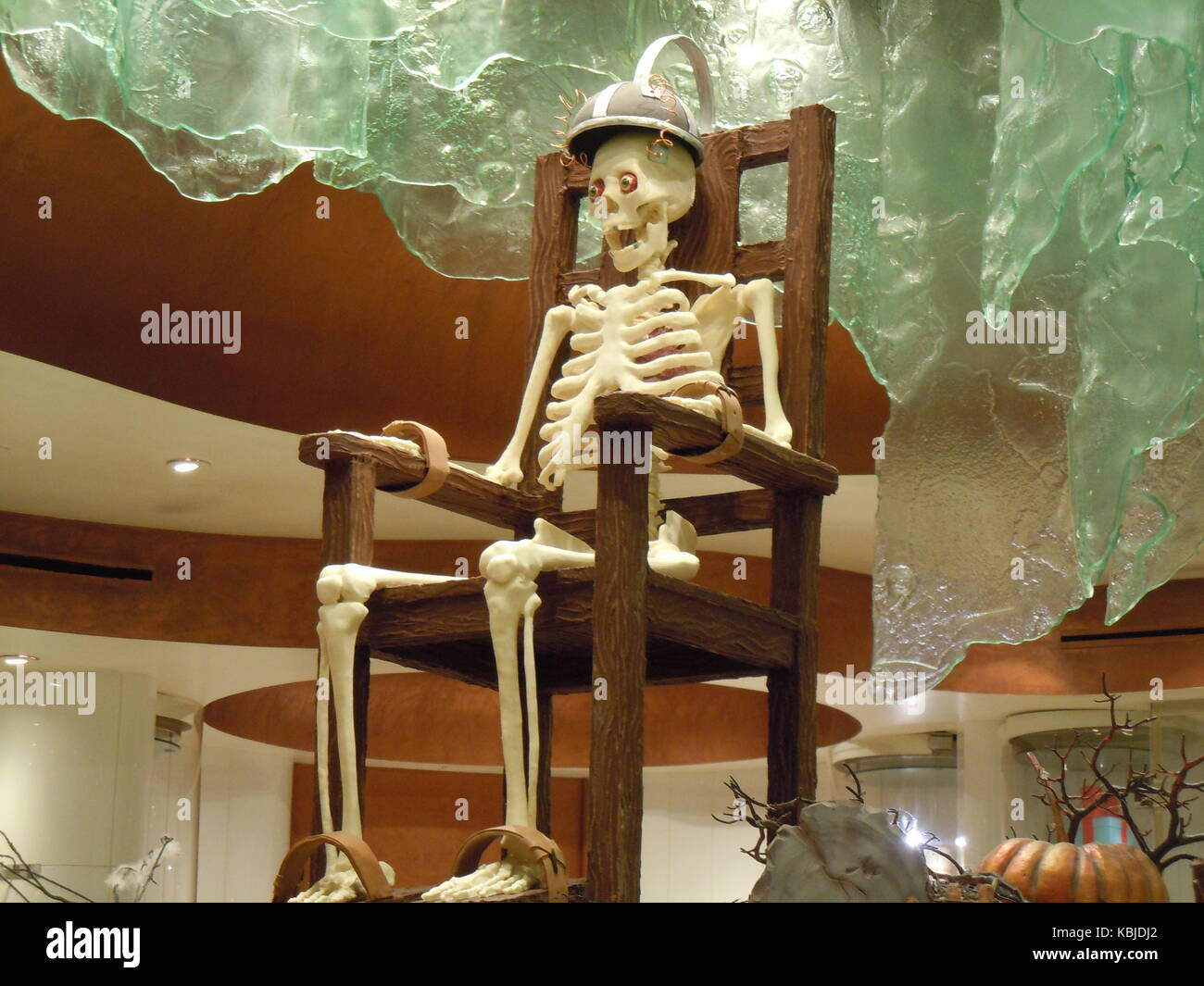 A skeleton sitting in an electric chair Stock Photo